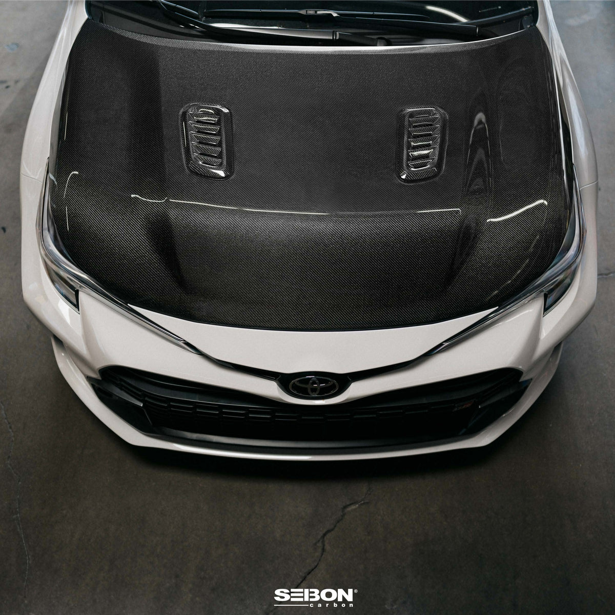 Seibon 23-24 Toyota GR Corolla OE-Style Double-Sided Carbon Fiber Hood - HD23TYGRCOR-OE-DS