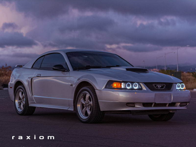 Raxiom 99-04 Ford Mustang Dual LED Halo Projector Headlights- Black Housing (Smoked Lens) - 49113