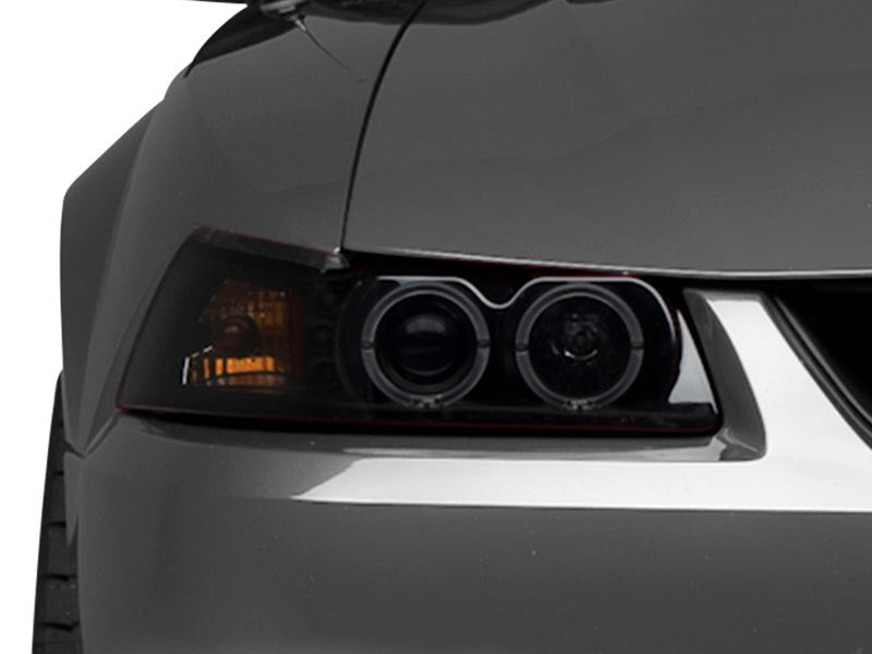 Raxiom 99-04 Ford Mustang Dual LED Halo Projector Headlights- Black Housing (Smoked Lens) - 49113