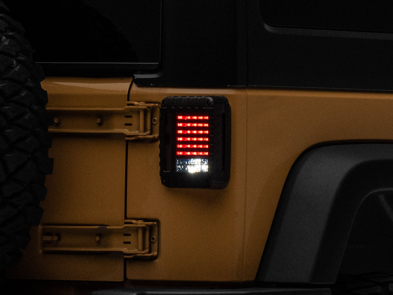 Raxiom 07-18 Jeep Wrangler JK LED Tail Lights- Black Housing (Smoked Lens) - J115435