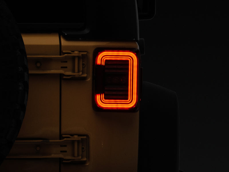 Raxiom 07-18 Jeep Wrangler JK Axial Series LED Halo Tail Lights- Black Housing (Dark Smoked Lens) - J138358