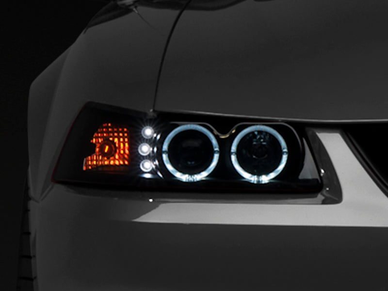 Raxiom 99-04 Ford Mustang Dual LED Halo Projector Headlights- Black Housing (Smoked Lens) - 49113