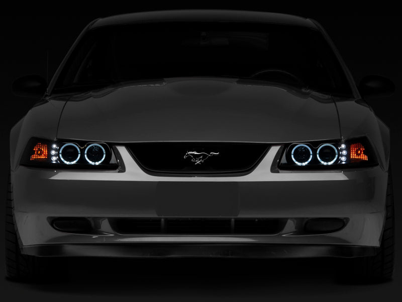 Raxiom 99-04 Ford Mustang Dual LED Halo Projector Headlights- Black Housing (Smoked Lens) - 49113